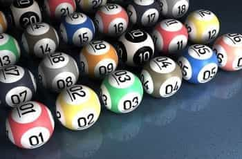 Multicolored bingo balls with numbers on.