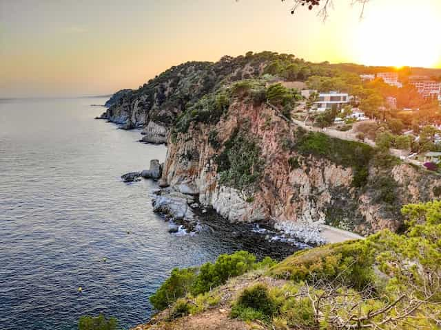 An aerial photo of the coastline at Catalonia at sunset.