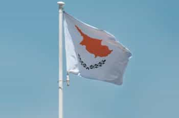 A flag against a blue sky.